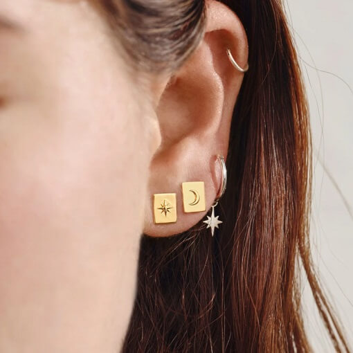 Earring curation featuring minimal gold studs and sterling silver hoops