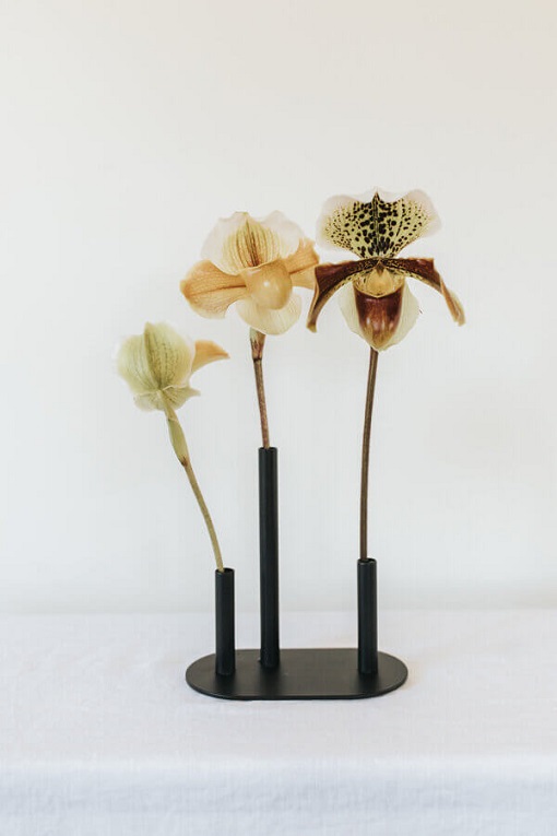 Oak Lab Design Low Stacked Black Vase with neutral orchids